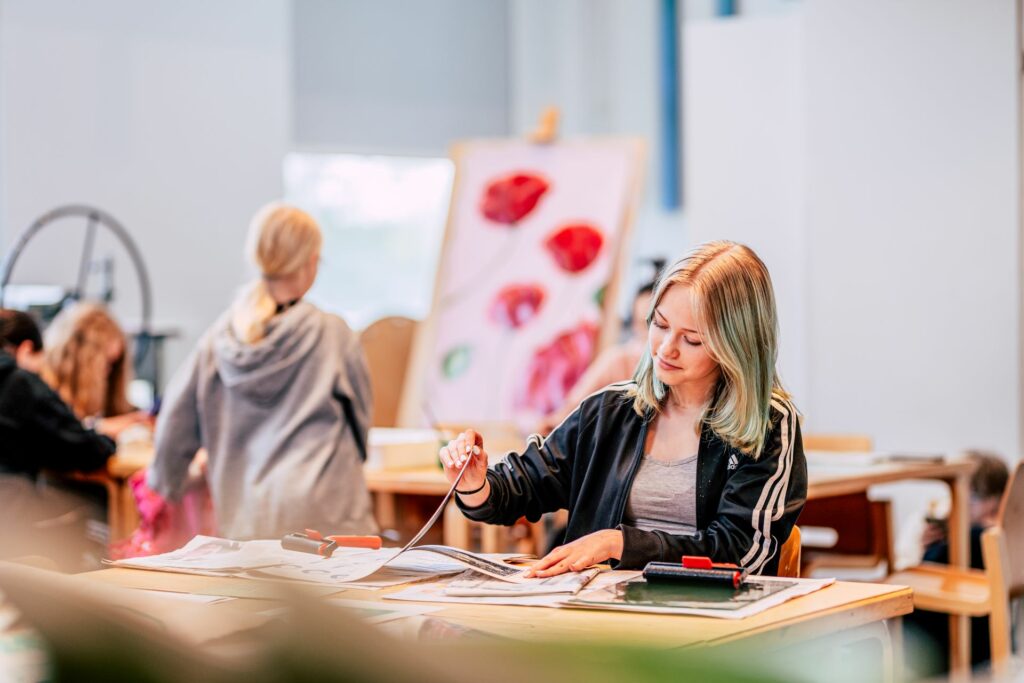 : A girl painting a work of art.